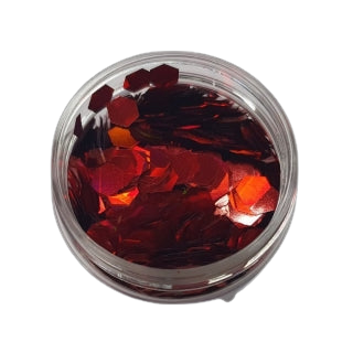 Rote Glitzerflocken (LB300) in einer klaren Schale auf schwarzem Hintergrund von FLEURY.
